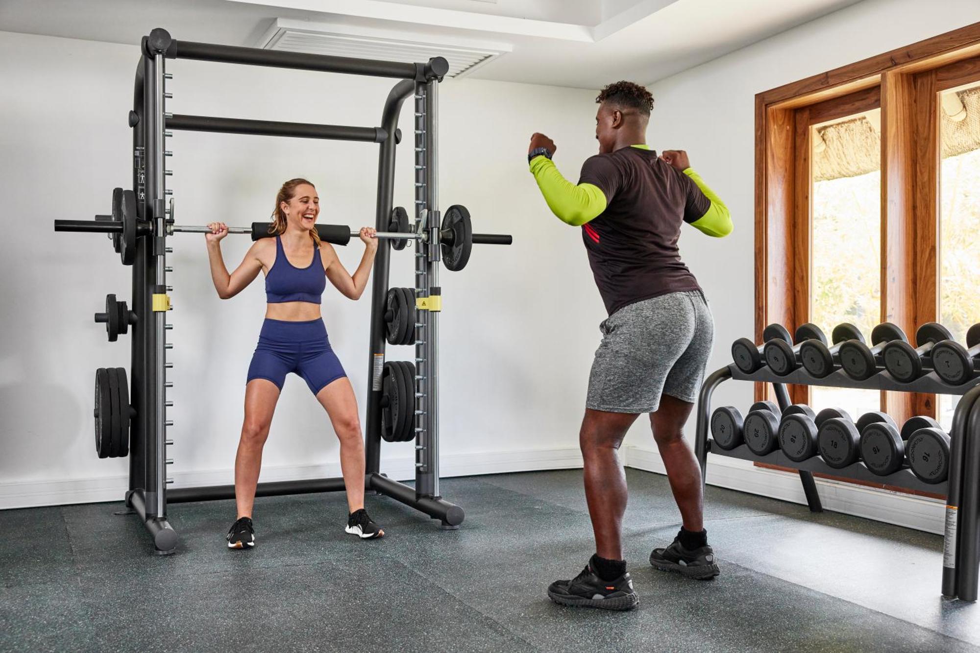 C Mauritius (Adults Only) Hotel Belle Mare Exterior foto Personal trainer with a client